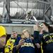 Michigan sophomores Nicole Werner (left) and Ashley Austin (right) throw newspapers in the air before the game on Friday. Daniel Brenner I AnnArbor.com